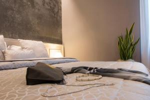 Postel nebo postele na pokoji v ubytování B&B PISTOIA INN