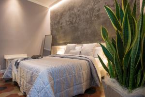 Postel nebo postele na pokoji v ubytování B&B PISTOIA INN