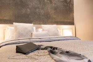 Postel nebo postele na pokoji v ubytování B&B PISTOIA INN