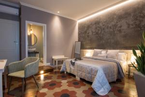 Postel nebo postele na pokoji v ubytování B&B PISTOIA INN