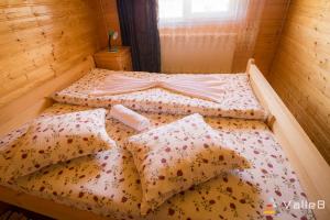 Postel nebo postele na pokoji v ubytování Cabana Ghetari