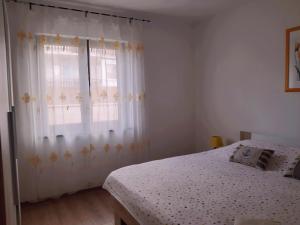 Postel nebo postele na pokoji v ubytování Apartments Monte Grande