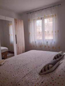 Postel nebo postele na pokoji v ubytování Apartments Monte Grande