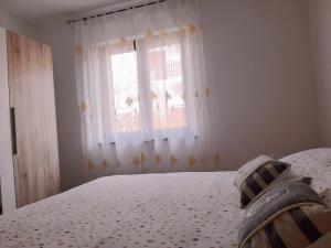 Postel nebo postele na pokoji v ubytování Apartments Monte Grande