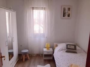 Postel nebo postele na pokoji v ubytování Apartments Monte Grande