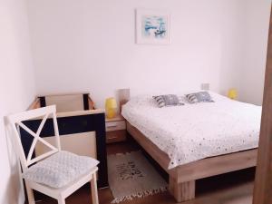 Postel nebo postele na pokoji v ubytování Apartments Monte Grande