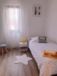 Postel nebo postele na pokoji v ubytování Apartments Monte Grande