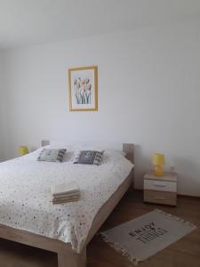 Postel nebo postele na pokoji v ubytování Apartments Monte Grande