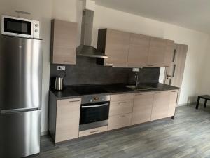 Una cocina o kitchenette en Penzion Fortuna Žatec