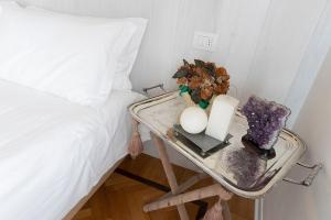Postel nebo postele na pokoji v ubytování Seven Suites Pieve
