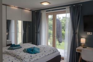 Ένα ή περισσότερα κρεβάτια σε δωμάτιο στο Ferienhaus Schleiharmonie