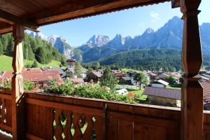 a balcony with a view of the mountains at Alpenlieben B&B in Sappada