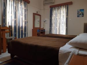 Ein Bett oder Betten in einem Zimmer der Unterkunft Hotel Ionion