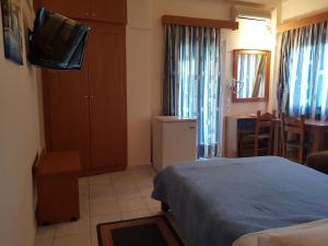 Ein Bett oder Betten in einem Zimmer der Unterkunft Hotel Ionion