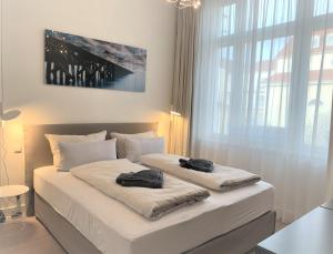 Ένα ή περισσότερα κρεβάτια σε δωμάτιο στο Ocean Cloud*****