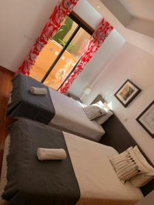 Postel nebo postele na pokoji v ubytování Luz Beach Luxury Apartment