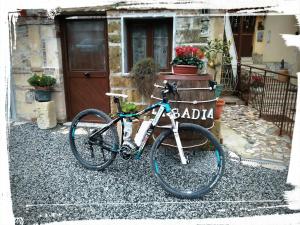 a bike parked in front of a house at La Badia in Messina +46 photos