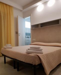 Postel nebo postele na pokoji v ubytování Hotel Ambasciata