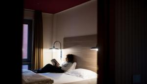 Postel nebo postele na pokoji v ubytování Hotel Torino