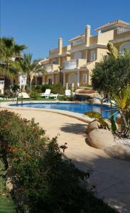 a large house with a swimming pool in front of it at VILLA DE SUABIA, Casa 9 in San Fulgencio