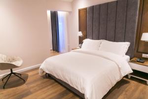 Postel nebo postele na pokoji v ubytování Arberia Palace Hotel