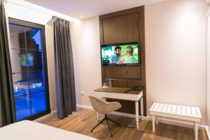 TV a/nebo společenská místnost v ubytování Arberia Palace Hotel