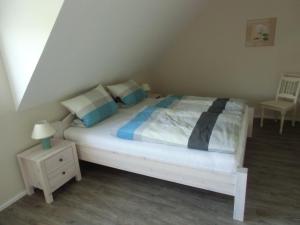 Postel nebo postele na pokoji v ubytování Ferienhaus Dat Fischerhus