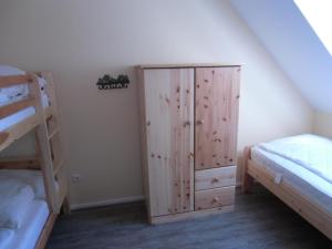 Postel nebo postele na pokoji v ubytování Ferienhaus Dat Fischerhus