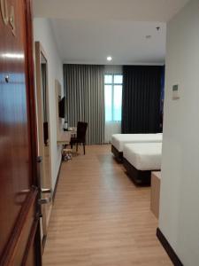 Postel nebo postele na pokoji v ubytování GiiA Sanno Hotel Pluit