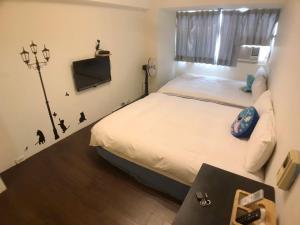 逢甲朵拉客房内的一张或多张床位