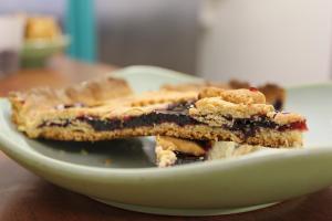 a plate of blueberry pie on a table at Country House La Valle Del Vento in Urbino