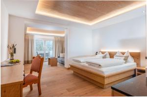 Krevet ili kreveti u jedinici u okviru objekta Spa&Aktiv Hotel Lavendel