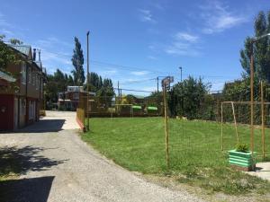 a field with a fence and a soccer goal at Cabañas Encantos in Castro