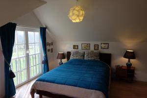 Postel nebo postele na pokoji v ubytování B&B Asbeek