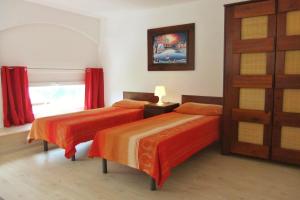 Postel nebo postele na pokoji v ubytování Casa le Palme