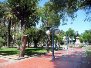a park with trees and street lights on a sidewalk at San Luis Centro in San Luis