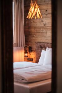 Letto o letti in una camera di Almdorf Omlach, Fanningberg