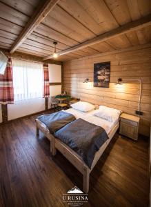 Posteľ alebo postele v izbe v ubytovaní Apartamenty u Rusina
