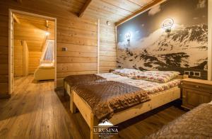 Posteľ alebo postele v izbe v ubytovaní Apartamenty u Rusina