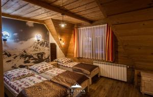 Posteľ alebo postele v izbe v ubytovaní Apartamenty u Rusina