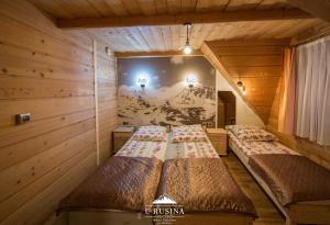 Posteľ alebo postele v izbe v ubytovaní Apartamenty u Rusina