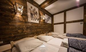 Posteľ alebo postele v izbe v ubytovaní Apartamenty u Rusina