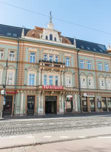 a large building on the side of a street at Comfy loft on Hlavna in Košice