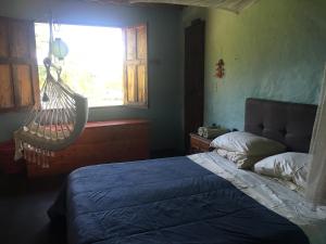 
A bed or beds in a room at Casa finca típica The Lake B&B
