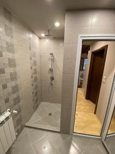 a bathroom with a shower with a glass door at Persey Villa Borovets in Borovets
