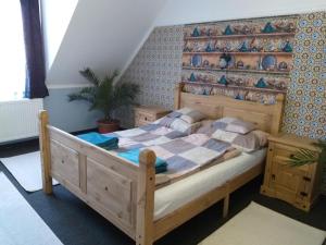 Un pat sau paturi într-o cameră la Hacienda Apartmanok