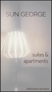 a lamp with the words sun greenhouse and suites and apartments at Sun George in Finikounta