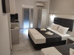 TV a/nebo společenská místnost v ubytování Alexion Apartments