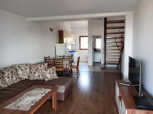 a living room with a couch and a table at Apartment Dasic in Bar