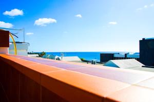 a view of the beach from the roof of a building at Casa Tigot in Puerto del Carmen